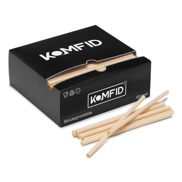 Box of biodegradable straws with KOMFID branding on a white background
